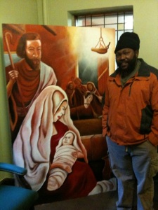 Bigga Gonzalez with the mural he painted during worship for Advent 2010. Each week the sermon and music focused on a different character in the Christmas story and so did the painting. Photograph by Jenn Cavanaugh.